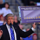 Donald Trump holds up a sign at a rally in Sunrise, Florida on August 10, 2016 (Photo by Johnny Louis/WireImage)